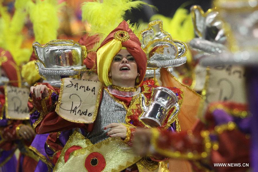 A reveller takes part in the carnival celebration, at the Sambadrome, in Sao Paulo, Brazil, on Feb. 10, 2013. (Xinhua/Rahel Patrasso) 