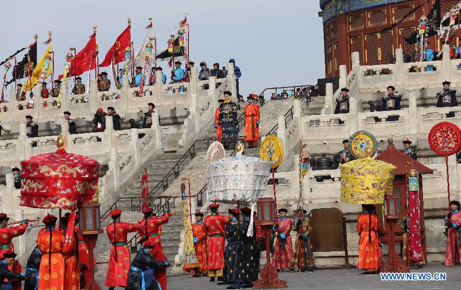 Performers wearing costumes of the Qing Dynasty (1644-1911) act during a performance presenting the ancient royal heaven worship ceremony in the Temple of Heaven in Beijing, capital of China, Feb. 10, 2013. The Temple of Heaven, first built in 1420 and used to be the imperial sacrificial altar during the Ming (1368-1644) and Qing dynasties, held reenaction of the ancient royal ritual for the worship of the heaven on Sunday, the first day of Chinese Lunar Year of the Snake. The performance will also be given in the next four days. (Xinhua/Liang Zhiqiang) 