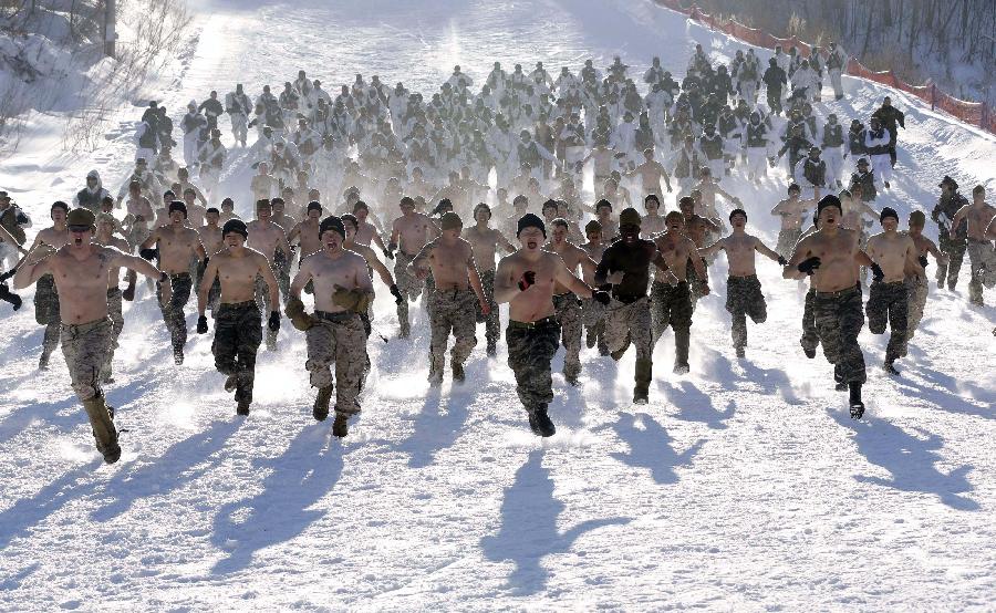 Marine Corps members of South Korea and the United States participate in the joint marine corps cold weather training at the Hwangbyeong mountain training field in Pyeongchang, South Korea, Feb. 7, 2013. About 400 soldiers from South Korea and the United States took part in a military winter drills, which began on February 4 and run through February 22, to test their limits in extreme conditions. (Xinhua/AP Photo)