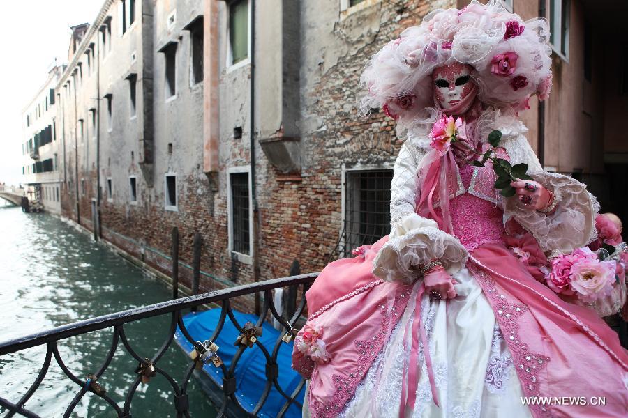 A costumed reveller participates in the carnival in Venice, Italy, on Feb. 10, 2013. The 18-day 2013 Venice carnival will end on Feb. 12. (Xinhua/Huang Xiaozhe) 