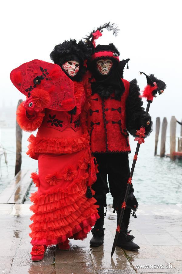 Costumed revellers participate in the carnival in Venice, Italy, on Feb. 10, 2013. The 18-day 2013 Venice carnival will end on Feb. 12. (Xinhua/Huang Xiaozhe) 