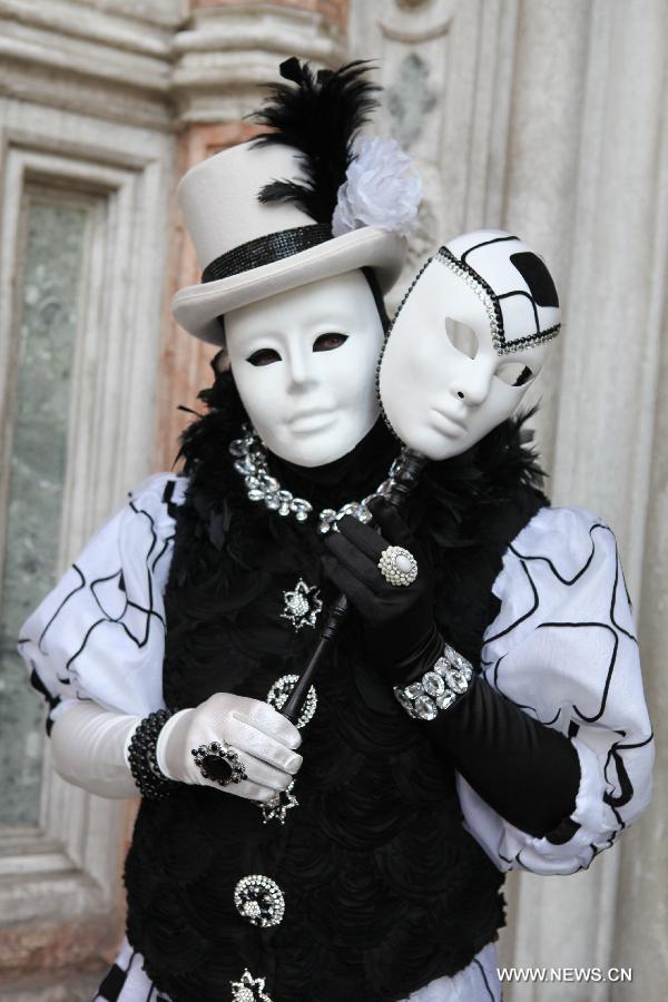 A costumed reveller participates in the carnival in Venice, Italy, on Feb. 10, 2013. The 18-day 2013 Venice carnival will end on Feb. 12. (Xinhua/Huang Xiaozhe) 