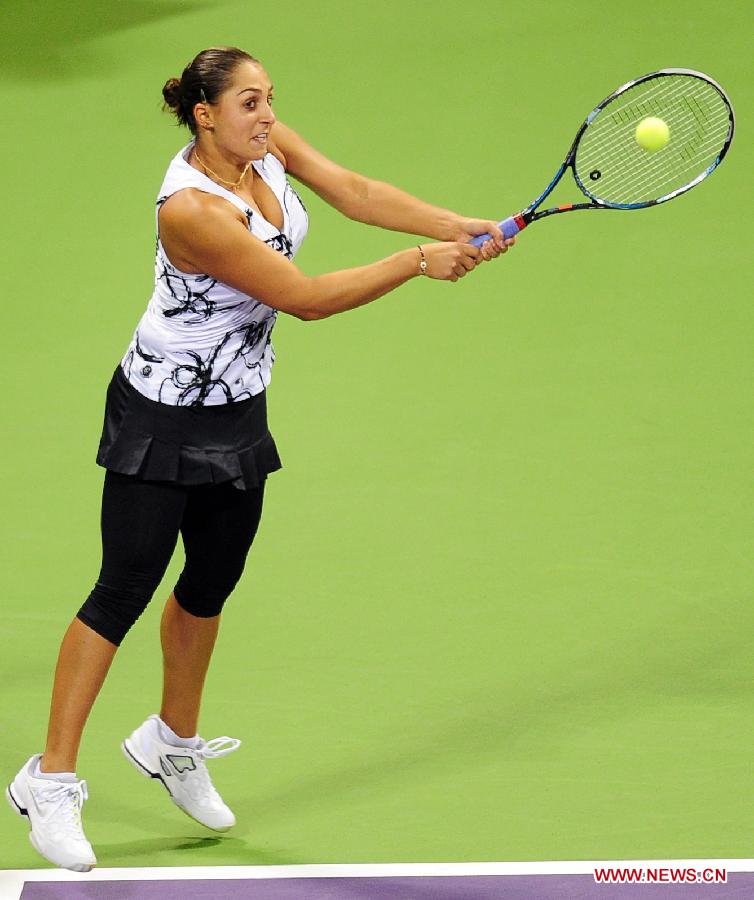 Tamira Paszek of Austria returns the ball during her match against Ana Ivanovic of Serbia on the first day of the WTA Qatar Open in Doha, Qatar, Feb. 11, 2013. Ivanovic won 2-0. (Xinhua/Chen Shaojin) 