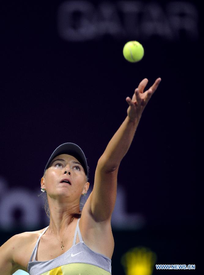 Maria Sharapova of Russia serves to Caroline Garcia of France during the women's singles first round match at the WTA Qatar Open tennis tournament in Doha, Qatar, Feb. 12, 2013. Sharapova won 2-0. (Xinhua/Chen Shaojin)