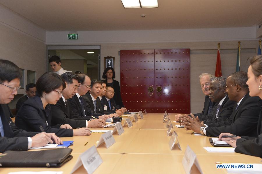 Chinese Vice Premier Hui Liangyu (3rd, L) meets with Kanayo F. Nwanze (3rd, R), president of the International Fund for Agricultural Development (IFAD), during the 36th Governing Council of IFAD in Rome, Italy, Feb. 13, 2013. (Xinhua/Liu Yu)