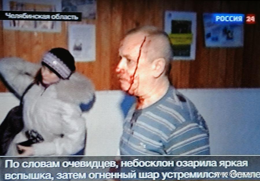 The TV grab shows an injured resident after a meteorite falling in the Chelyabinsk region in Russia, Feb. 15, 2013.(Xinhua) 