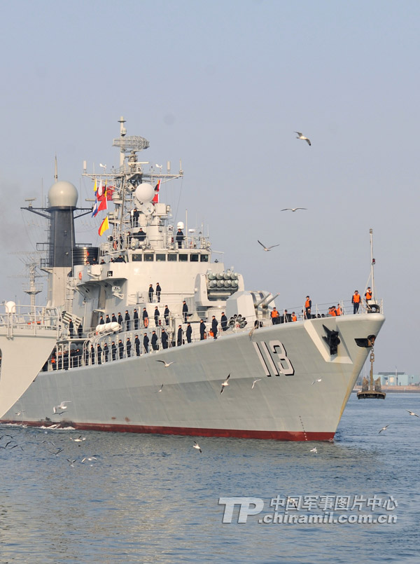 The high-sea training ship formation under North China Sea Fleet of the Navy of the Chinese People’s Liberation Army (PLA), comprising of the “Qingdao” guided missile destroyer and the “Yantai” and “Yancheng” guided missile frigates, successfully completed the training mission in the West Pacific waters and returned to a military port in Qingdao in east China’s Shandong province at 9:00 a.m. on February 15, 2013. The photo shows the “Qingdao” warship, commanding ship of the formation, returns to home port. (China Military Online/Wang Songqi)