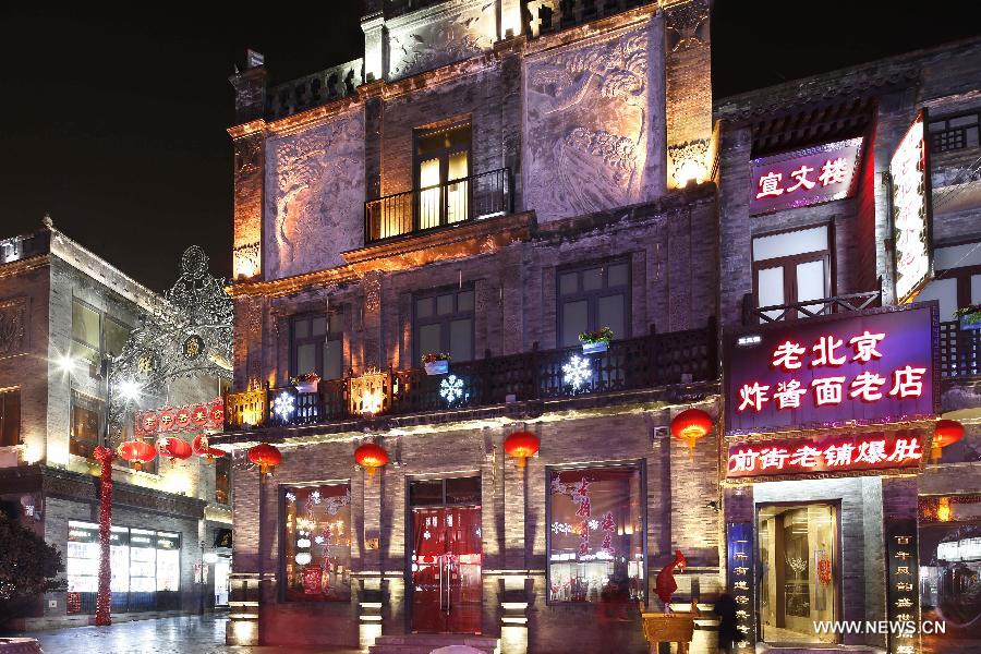 Photo taken on Feb. 15, 2013 shows the night scene of the Qianmen Street, a well-know commercial street, in downtown Beijing, capital of China. (Xinhua/Zhao Bing)  