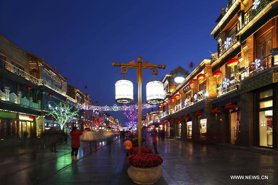 Photo taken on Feb. 15, 2013 shows the night scene of the Qianmen Street, a well-know commercial street, in downtown Beijing, capital of China. (Xinhua/Zhao Bing)  