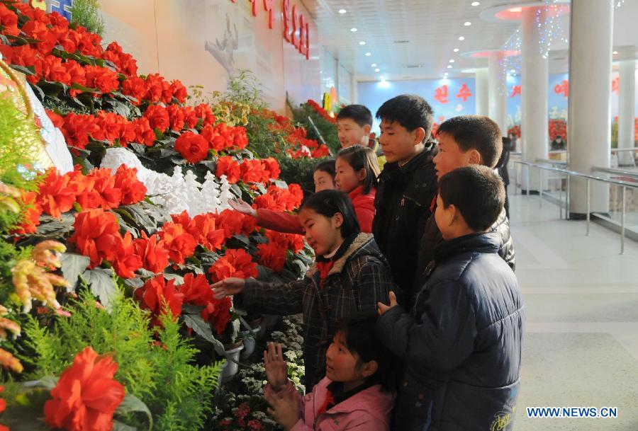 People visit a flower exhibition named after late leader Kim Jong Il in Pyongyang, capital of the Democratic People's Republic of Korea (DPRK), Feb. 15, 2013. (Xinhua/Du Baiyu)