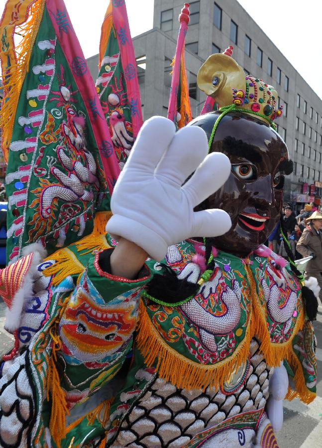 A person dressed up as the ancient Chinese fairy figure participates in a parade to celebrate the traditional Chinese Lunar New Year in Flushing of the Queens Borough of New York, Feb. 16, 2013. (Xinhua/Wang Lei) 