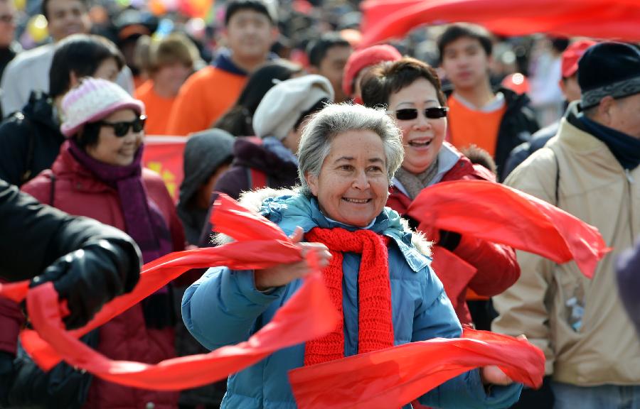 Overseas Chinese seniors participate in the parade to celebrate the traditional Chinese Lunar New Year in Flushing of the Queens Borough of New York, Feb. 16, 2013. (Xinhua/Wang Lei) 