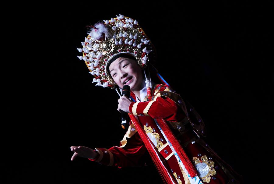 A young artist performs Yuju Opera during a show by China's "Cultures of China, Festival of Spring" art group in Paris, capital of France, Feb. 16, 2013. (Xinhua/Gao Jing) 