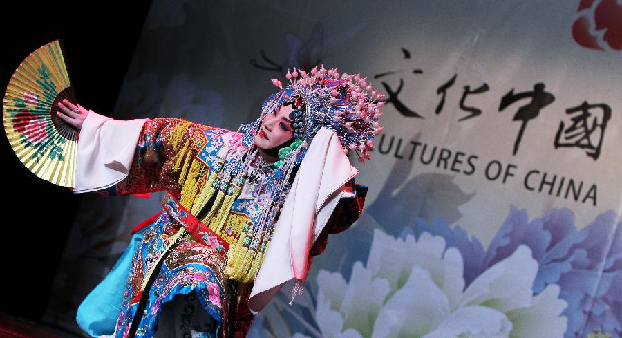 Beijing Opera master Hu Wenge performs during a show by China's "Cultures of China, Festival of Spring" art group in Paris, capital of France, Feb. 16, 2013. (Xinhua/Gao Jing) 