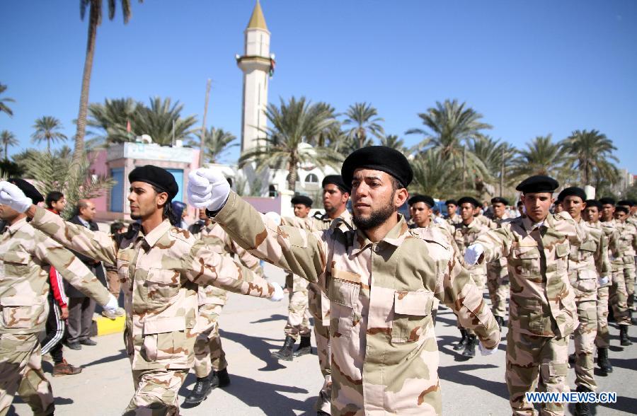 Libyan soldiers demonstrate their skills during a celebration for the second anniversary of the uprising that toppled the regime of strongman Muammar Gaddafi in the Tajoura area in the Libyan capital Tripoli, on Feb. 17, 2013. (Xinhua/Hamza Turkia) 