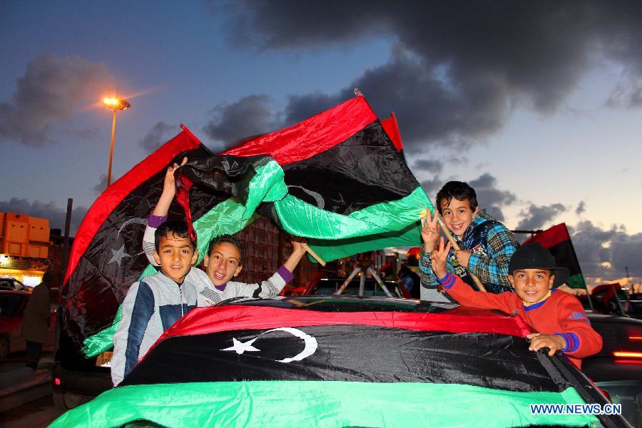 Libyan people attend a celebration for the second anniversary of the uprising that toppled the regime of strongman Muammar Gaddafi in Benghazi, on Feb. 17, 2013. (Xinhua/Mohammed El Shaiky) 