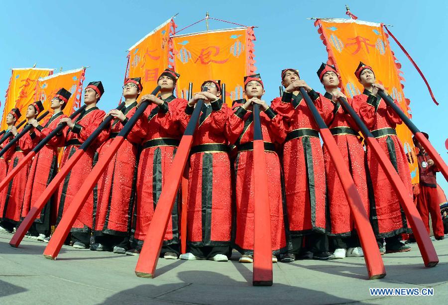File photo taken on April 1, 2012 shows Shehuo performers attending a Qingming Festival parade in Kaifeng, central China's Henan Province. (Xinhua/Wang Song)