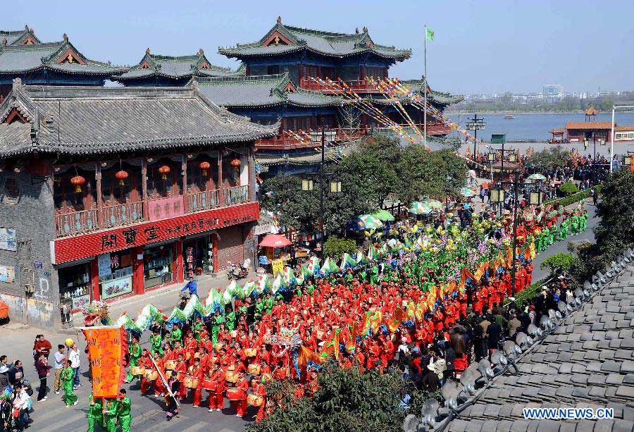 File photo taken on April 1, 2012 shows members of a Shehuo performance team attending a Qingming Festival parade in Kaifeng, central China's Henan Province. (Xinhua/Wang Song)