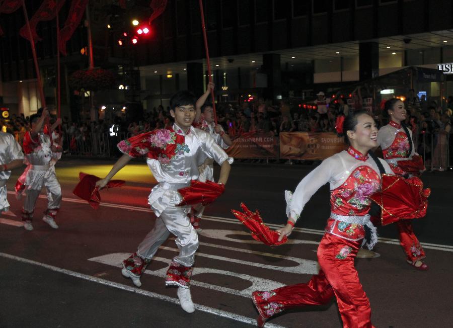 Performers participate in a parade celebrating the Lunar New Year in Sydney, Australia, Feb. 17, 2013. (Xinhua/Jin Linpeng)
