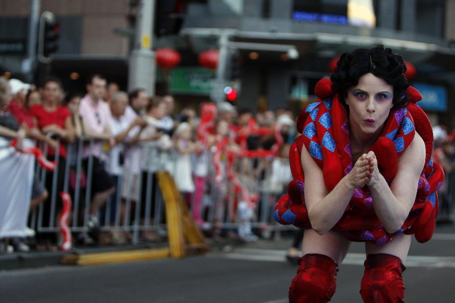 A performer in snake costume participates in a parade celebrating the Lunar New Year in Sydney, Australia, Feb. 17, 2013. (Xinhua/Jin Linpeng) 