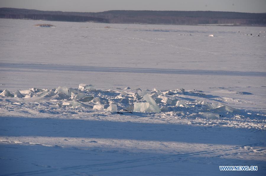 Photo taken on Feb. 16, 2013 shows an ice hole of the chebarkul lake near Chelyabinsk, about 1,500 kilometers east of Moscow, Russia. Scientists have found fragments of a meteor that exploded over Russia's central Urals and triggered a shock wave that injured hundreds and shattered scores of windows, experts said Monday. (Xinhua/Jiang Kehong)  