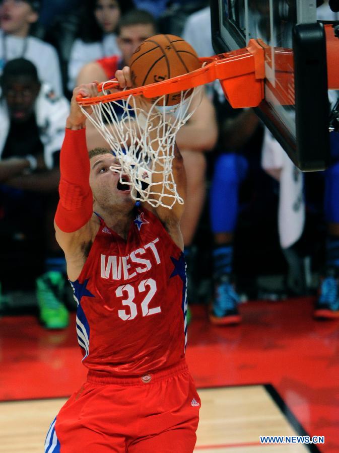 Blake Griffin of the Los Angeles Clippers and the Western Conference dunks during the 2013 NBA All-Star game at the Toyota Center in Houston, the United States, Feb. 17, 2013. (Xinhua/Yang Lei) 