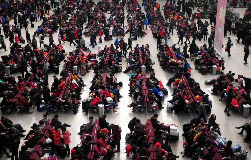 Passengers fill the waiting hall of the Shenyang railway station, Feb. 15, 2013. At the end of the Spring Festival holiday, China saw a travel rush as millions of workers move to big cities for better working opportunities. (Xinhua/Jiang Bing)