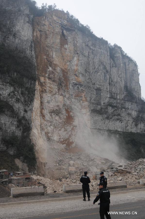 Rescuers search for survivors of a landslide accident in Longchang Township in the city of Kaili, southwest China's Guizhou Province, Feb. 18, 2013. Initial investigation has found that five people, including two children, were buried after a landslide hit southwest China's Guizhou Province on Monday morning. The landslide happened around 11 a.m. in Longchang Township, burying six work sheds. (Photo/ Xinhua)
