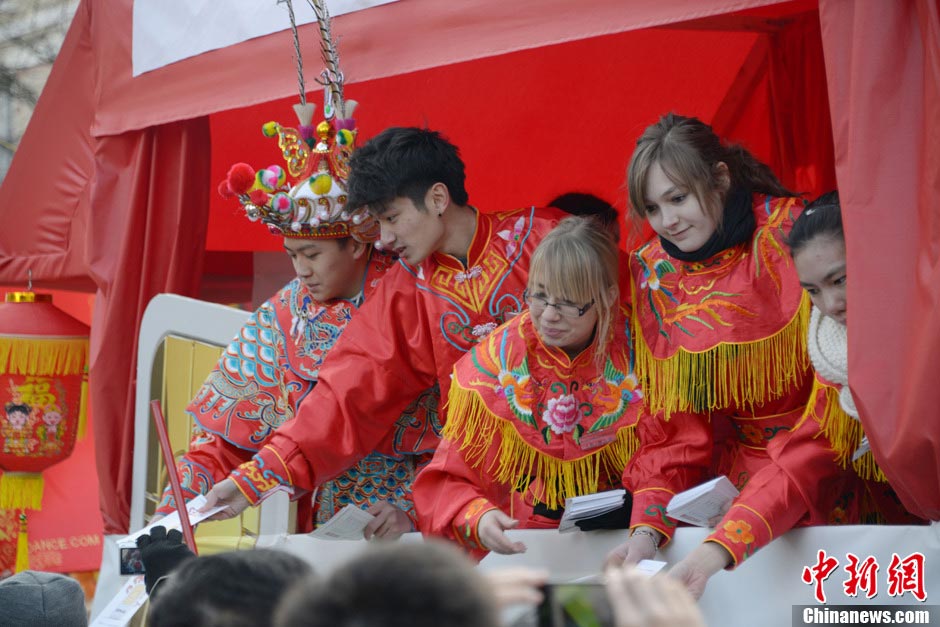 People in costumes of China's ethnic minorities participate in a parade to celebrate the traditional Chinese Lunar New Year in Paris, France, February 17, 2013. (CNS/Long Jianwu)