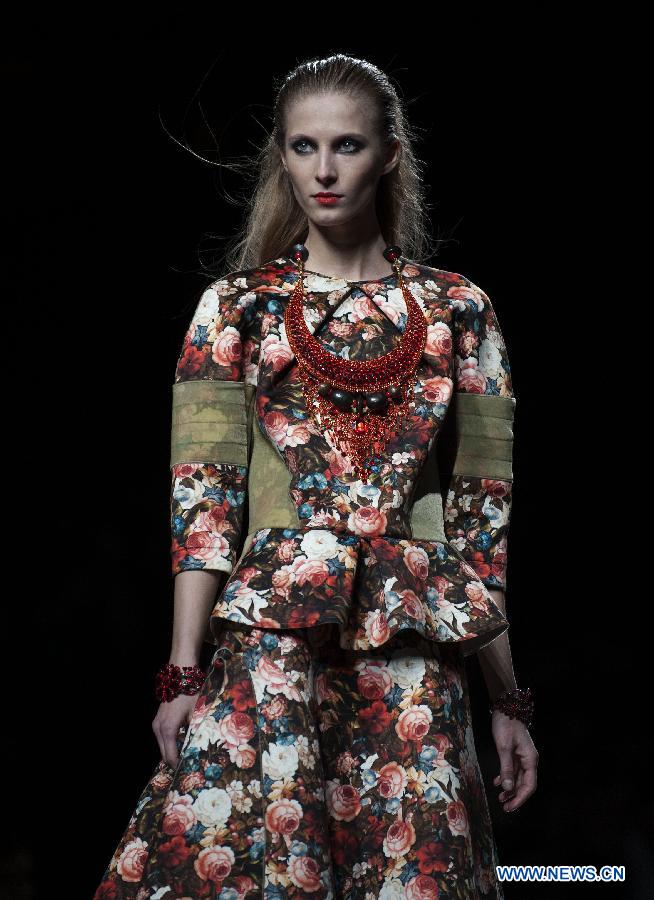A model presents a creation by Teresa Helbig during Madrid Fashion Week in Madrid, Spain, on Feb. 18, 2013. (Xinhua/Xie Haining) 