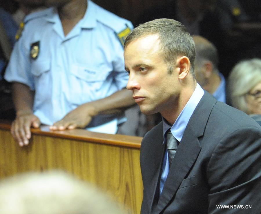 South African Olympic sprinter Oscar Pistorius appears at the Magistrate's Court to hear judgment on his bail application in Pretoria, South Africa, on Feb. 19, 2013. This was the second time that Pistorius appeared in court since he was arrested last Thursday for allegedly shooting model Reeva Steenkamp at his Pretoria home. (Xinhua/Li Qihua) 