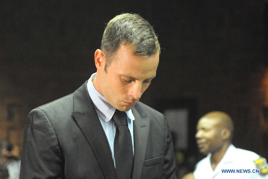 Paralympian Oscar Pistorius appears at the Pretoria Magistrate Court, South Africa, on Feb. 20, 2013. The bail hearing of murder-accused Pistorius resumed at the Pretoria Magistrate Court on Wednesday with a large media contingent scrambling to get inside. (Xinhua/Li Qihua) 