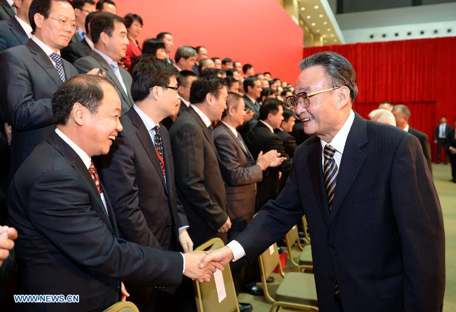 Wu Bangguo (R), chairman of the National People's Congress (NPC) Standing Committee, meets with representatives of the offices set up by the central authorities in Macao as well as those of some Macao-based mainland enterprises in Macao, south China, Feb. 20, 2013. (Xinhua/Ma Zhancheng) 