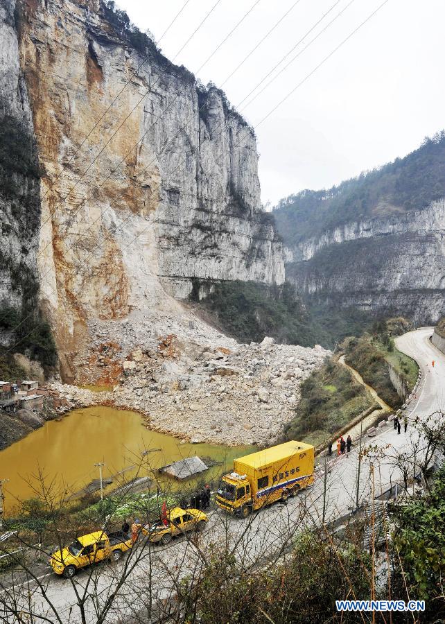 Workers drain water from a barrier lake in Longchang Township, Kaili City, southwest China's Guizhou Province, Feb. 20, 2013. Five coal mine workers and their relatives, including two children, are believed to have been buried by a landslide which occurred around 11 a.m. here on Feb. 18. Rocks have blocked a nearby river with a rising water level, forming a barrier lake. The water level has decreased for 1.5 meters as of 5 p.m. Wednesday. (Xinhua/Yao Yao) 