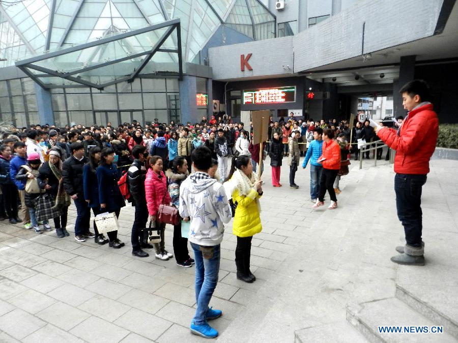 Examinees wait to sign up for the entrance examination of the Beijing Film Academy (BFA) in Beijing, capital of China, Feb. 21, 2013. BFA is one of China's leading bases of movie education, where many movie celebrities like director Zhang Yimou and numerous actors graduated. With the dreams to become future movie stars, thousands of young people cram to BFA for the enrollment exam every year. (Xinhua/Wang Zhen)