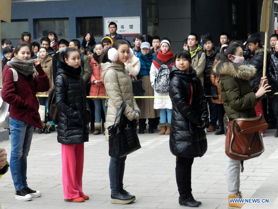 Examinees wait to sign up for the entrance examination of the Beijing Film Academy (BFA) in Beijing, capital of China, Feb. 21, 2013. BFA is one of China's leading bases of movie education, where many movie celebrities like director Zhang Yimou and numerous actors graduated. With the dreams to become future movie stars, thousands of young people cram to BFA for the enrollment exam every year. (Xinhua/Wang Zhen) 