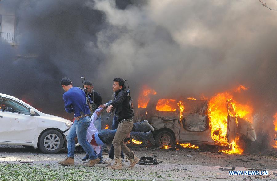 A handout picture released by the official Syrian Arab News Agency (SANA) shows people transferring the injured after a blast in Damascus, Syria, Feb. 21, 2013. A big blast rocked a busy intersection in the capital Damascus Thursday close to the ruling al-Baath party headquarters, leaving unspecified number of casualties, witnesses and reports said. (Xinhua/SANA)