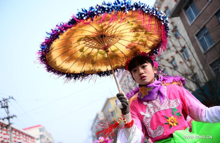 A performer takes part in a Shehuo parade in Huangzhong County, northwest China's Qinghai province, Feb. 21, 2013. The performance of Shehuo can be traced back to ancient rituals to worship the earth, which they believe could bring good harvests and fortunes in return. Most Shehuo performances take place around traditional Chinese festivals, especially the Spring Festival and the Lantern Festival. (Xinhua/Zhang Hongxiang) 