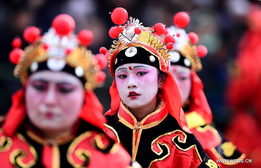 Performers take part in a Shehuo parade in Huangzhong County, northwest China's Qinghai province, Feb. 21, 2013. The performance of Shehuo can be traced back to ancient rituals to worship the earth, which they believe could bring good harvests and fortunes in return. Most Shehuo performances take place around traditional Chinese festivals, especially the Spring Festival and the Lantern Festival. (Xinhua/Zhang Hongxiang) 