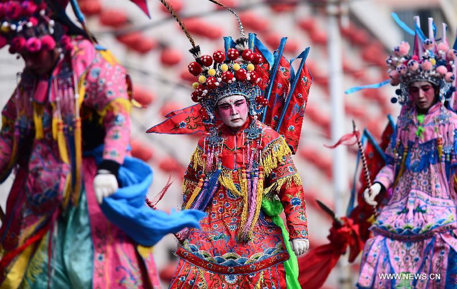 Performers take part in a Shehuo parade in Huangzhong County, northwest China's Qinghai province, Feb. 21, 2013. The performance of Shehuo can be traced back to ancient rituals to worship the earth, which they believe could bring good harvests and fortunes in return. Most Shehuo performances take place around traditional Chinese festivals, especially the Spring Festival and the Lantern Festival. (Xinhua/Zhang Hongxiang)