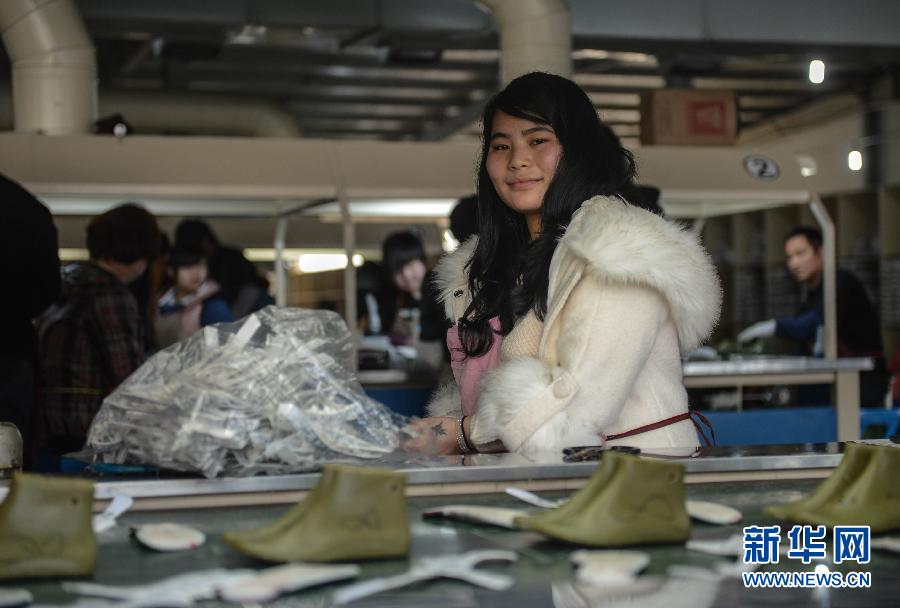 Huang Jianmei, 20, works in a shoe factory in Wenling on Feb. 17, 2013. She is from Sichuan; she wants to save some money to open a cosmetic shop, but the dream seems so far away. (Xinhua/ Han Chuanhao)