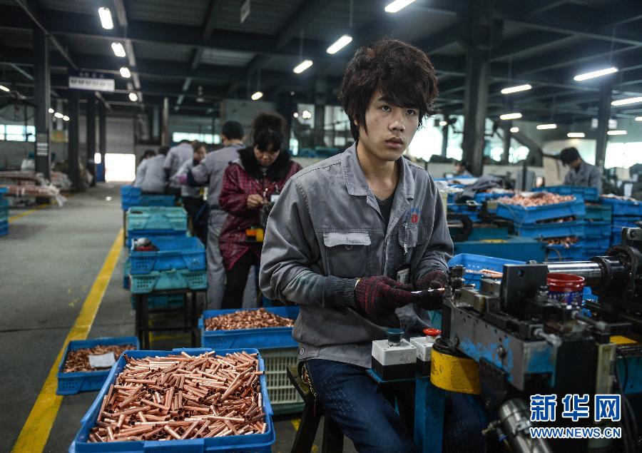 Huang Weidong, 21, from Anhui, works in an air conditioner accessory company as a workshop operator in Wenling, Zhejiang on Feb. 17, 2013. He started to work after junior high school and had changed a number of jobs. He has no plan for future. (Xinhua/ Han Chuanhao)