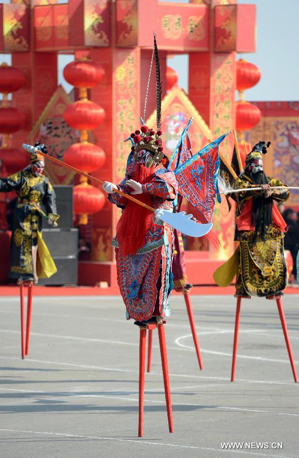 Performers take part in a Shehuo parade in Longxian County, northwest China's Shanxi Province, Feb. 22, 2013. The performance of Shehuo can be traced back to ancient rituals to worship the earth, which they believe could bring good harvests and fortunes in return. Most Shehuo performances take place around traditional Chinese festivals, especially the Spring Festival and the Lantern Festival. (Xinhua/Li Yibo)