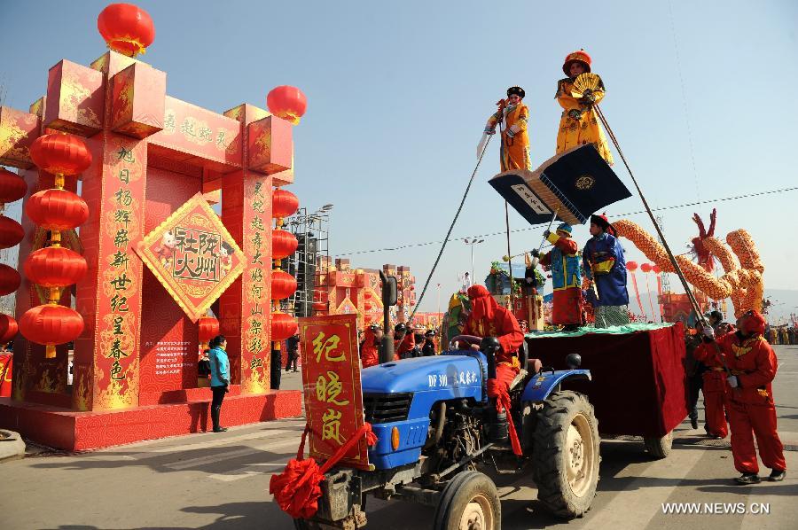 Performers take part in a Shehuo parade in Longxian County, northwest China's Shanxi Province, Feb. 22, 2013. The performance of Shehuo can be traced back to ancient rituals to worship the earth, which they believe could bring good harvests and fortunes in return. Most Shehuo performances take place around traditional Chinese festivals, especially the Spring Festival and the Lantern Festival. (Xinhua/Li Yibo)