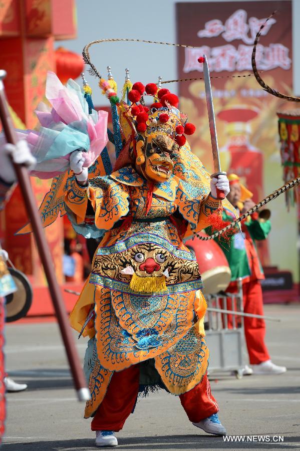 A performer takes part in a Shehuo parade in Longxian County, northwest China's Shanxi Province, Feb. 22, 2013. The performance of Shehuo can be traced back to ancient rituals to worship the earth, which they believe could bring good harvests and fortunes in return. Most Shehuo performances take place around traditional Chinese festivals, especially the Spring Festival and the Lantern Festival. (Xinhua/Li Yibo)