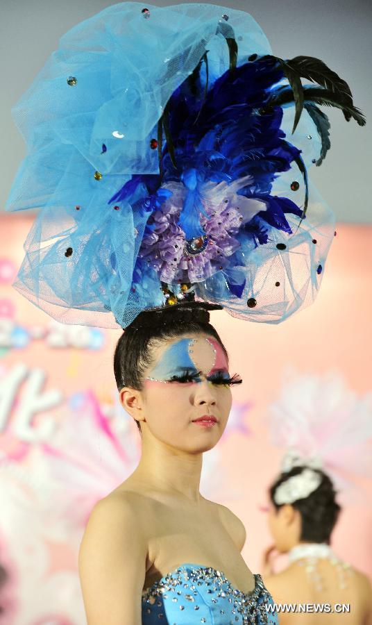 A model presents a make-up design at the 23rd International Cosmetics Exhibition at Taipei World Trade Center in Taipei, southeast China's Taiwan, Feb. 22, 2013. Opened Friday, the five-day event attracted some 160 exhibitors. (Xinhua/Wu Ching-teng) 