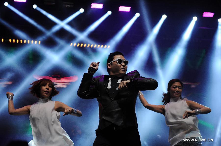 South Korean rapper Park Jae-sang (front) performs on the stage during the concert in Istanbul, Turkey, on Feb. 22, 2013. South Korean rapper Park Jae-sang, better known as PSY, performed a concert on Friday in Istanbul's festival "Istanbul Blue Night". (Xinhua/Ma Yan) 