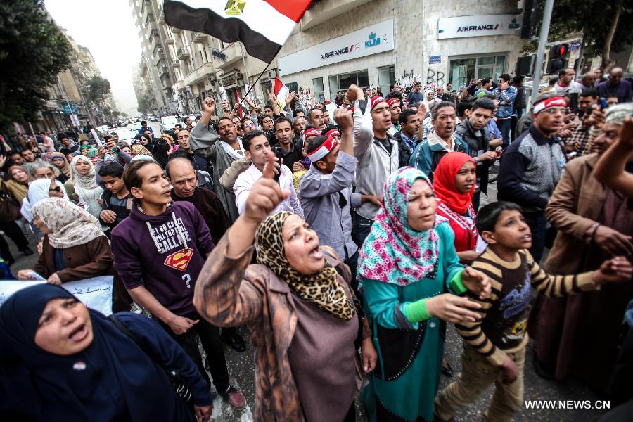 Egyptians shout slogans during an anti-government protest in Cairo on Feb. 22, 2013. Thousands of Egyptians held nationwide anti-government protests Friday, demanding sacking the government and dissolving the Muslim Brotherhood, to which President Mohamed Morsi is affiliated. (Xinhua/Amru Salahuddien)