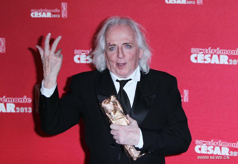 French costume designer Christian Gasc pose with his Best Costume award for 'Les Adieux a la Reine' during the 38th annual Cesar awards ceremony held at the Chatelet Theatre in Paris, France, 22 February 2013. (Xinhua/Gao Jing)