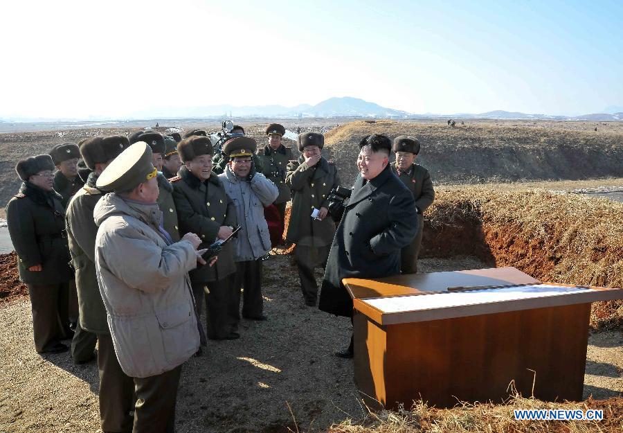 This undated picture released by Korean Central News Agency (KCNA) on Feb. 23, 2013 shows top leader of the Democratic People's Republic of Korea (DPRK) Kim Jong Un (2nd R) watching a flight exercise and a paratrooping drill of the Air Force and Anti-Air Force and Large Combined Unit 630. (Xinhua/ Korean Central News Agency)